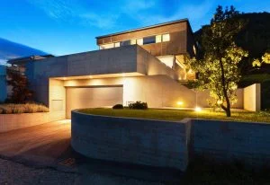 Modern home exterior with security lighting protecting the entrance at night