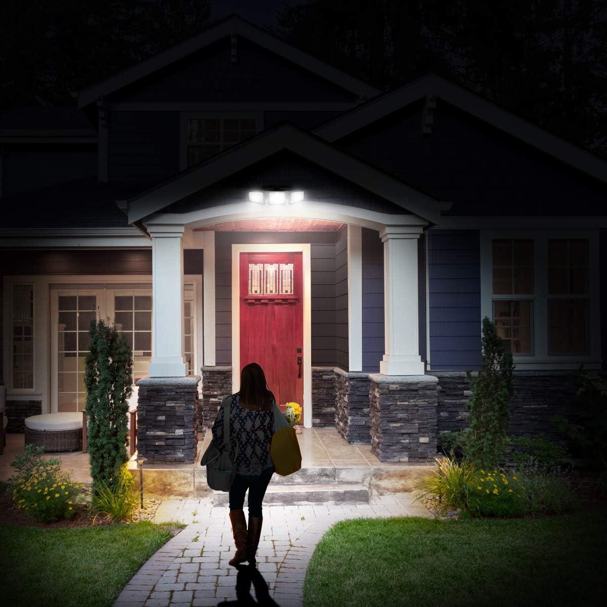 Motion sensor security light illuminating a home's front entrance at night