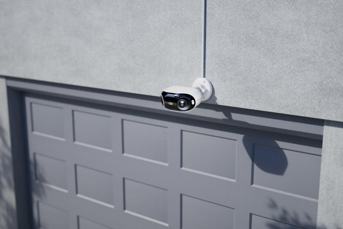Security camera positioned to monitor home driveway and garage